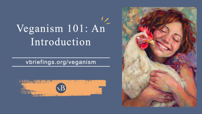 A graphic titled “Veganism 101: An Introduction” with the URL vbriefings.org/veganism on a muted blue background. On the right is a painterly illustration of a smiling woman with curly hair gently hugging a white chicken, conveying warmth and care. The vBriefings logo appears below the title.